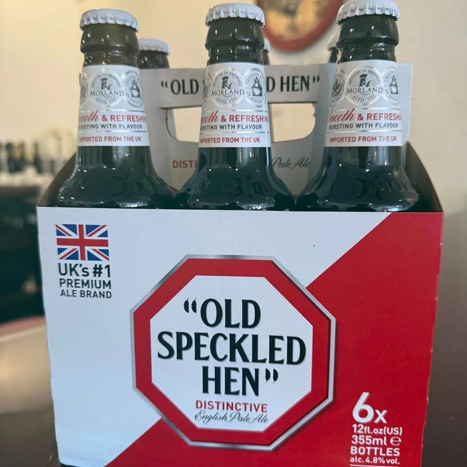 A six-pack of "Old Speckled Hen" English Pale Ale bottles, imported from the UK.